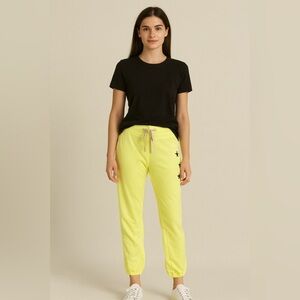 Sundry Neon Yellow Joggers with Black Star Detail Size M NWOT